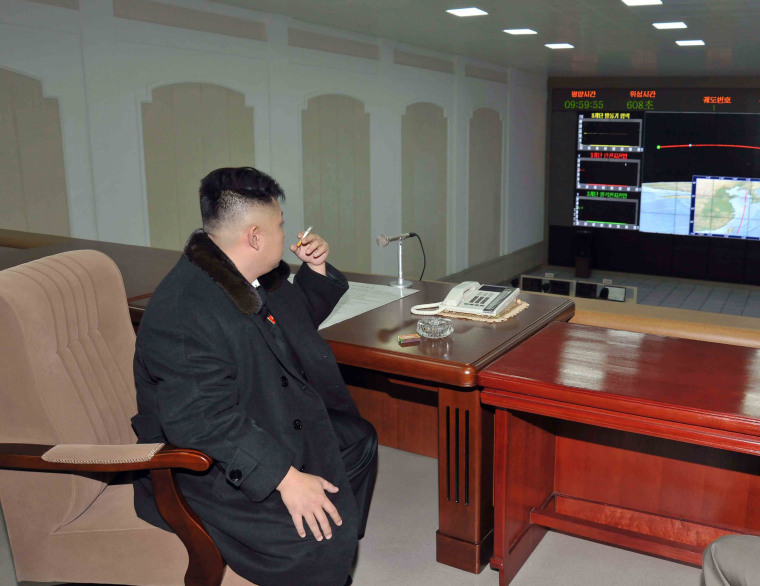 Image: North Korean leader Kim Jong-Un smokes a cigarette at the General Satellite Control and Command Center in this picture released by the North's KCNA news agency in Pyongyang